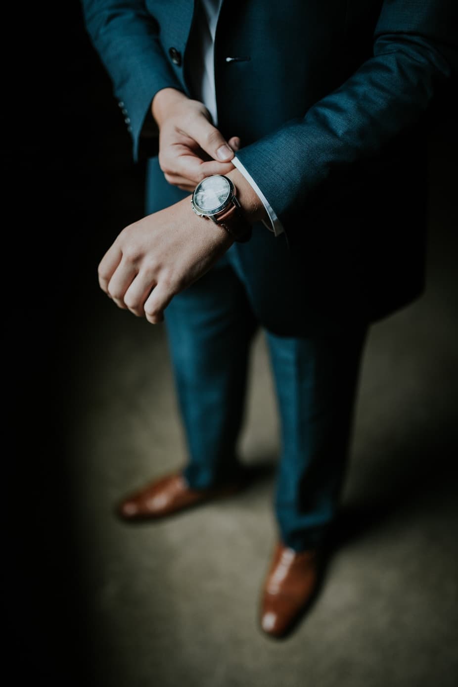 A person adjusting their watch